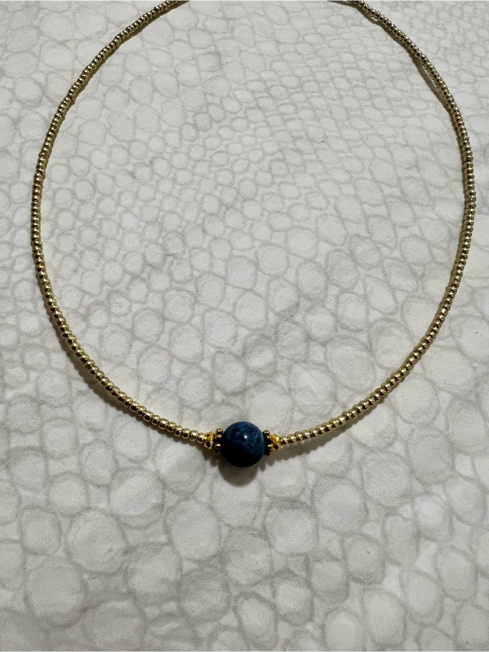 Handmade Gold Beaded Necklace with Navy Blue Accent Bead